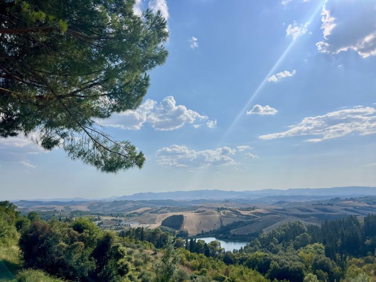 Panoramic view from Castelfalfi Tuscany over the hills of Tuscany, perfect for luxury travel lifestyle inspiration and personal reinvention at 40.
