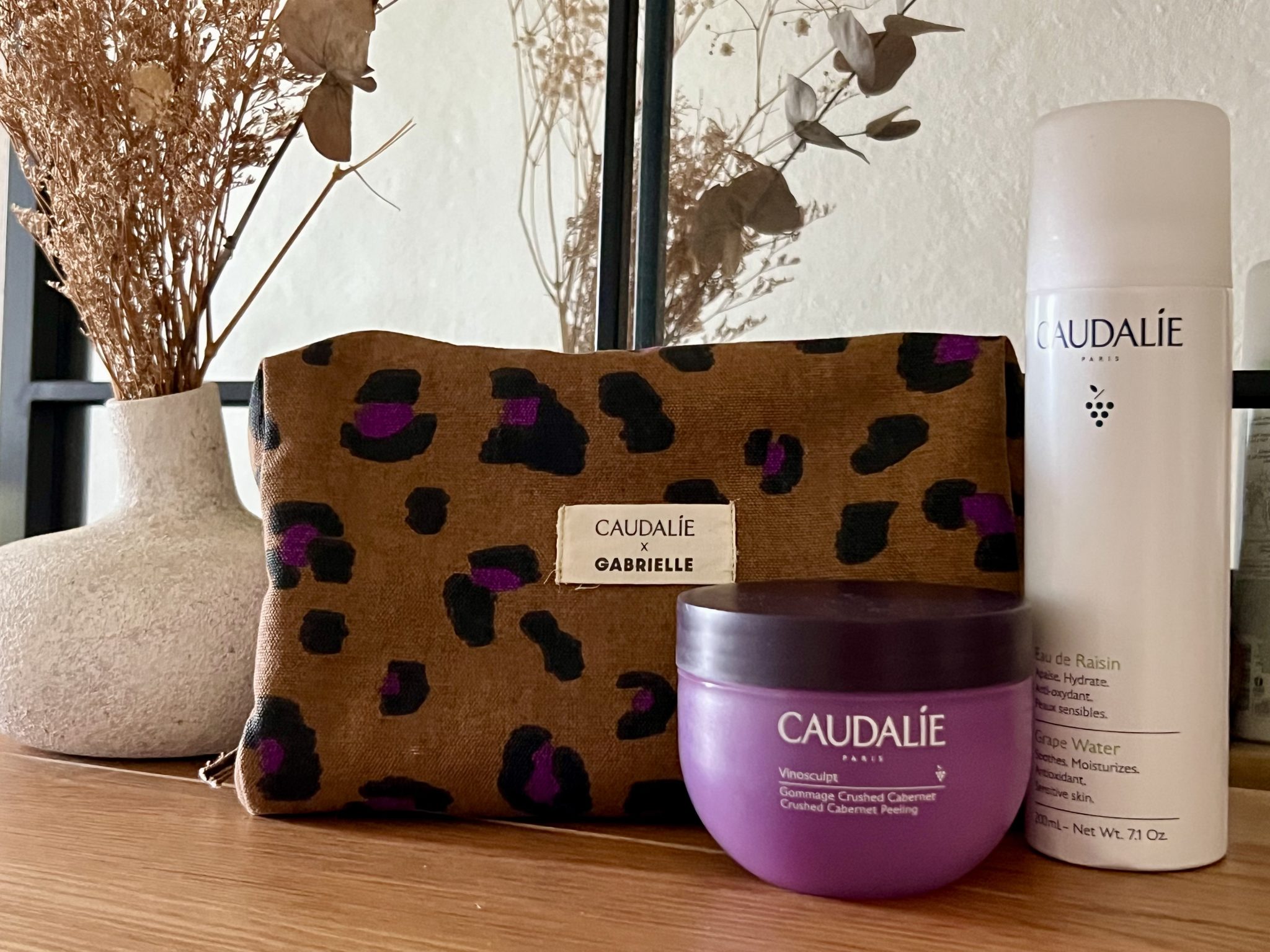 Caudalie Grape Water and Vinosculpt Crushed Cabernet Peeling with Gabrielle vanity in leopard print and reed wine grape, part of luxury travel lifestyle edit.